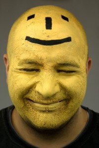 Creativity through laughter with painted yellow face