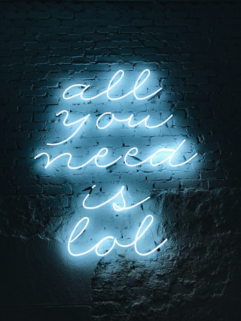 neon lights "all you need is LOL" Laughing Yoga